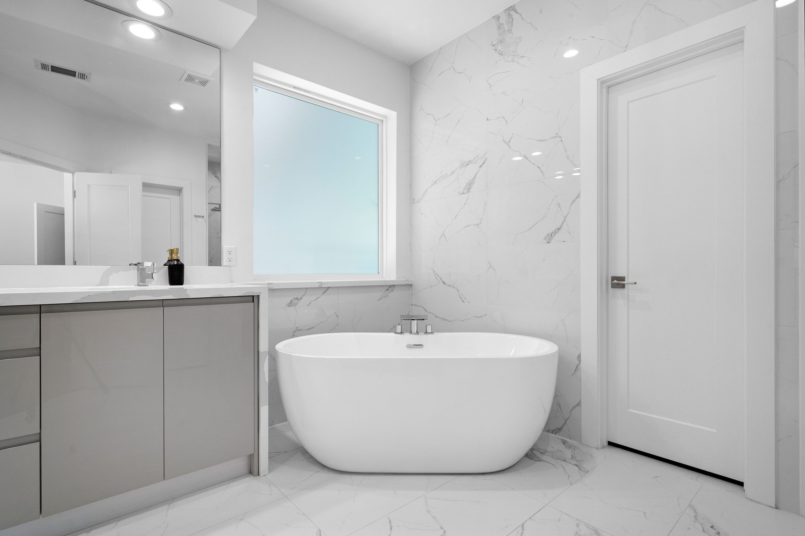 Bathroom Windows That Offer Light and Privacy modern luxury bathroom with picture windows