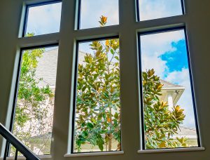 large aluminum picture windows interior of two story house