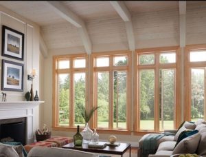 interior of a modern living room with large wood clad windows