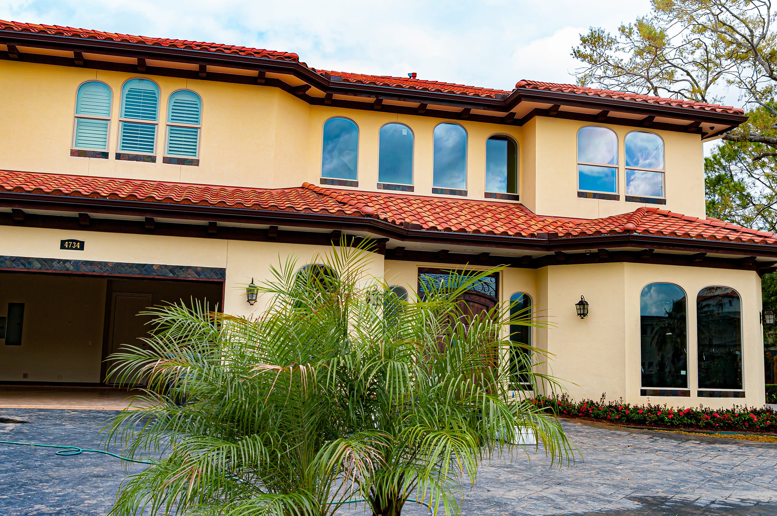 Choosing Custom Windows Frames to Upgrade Your Home Texas spanish tile home with custom window frames by milestone windows & doors
