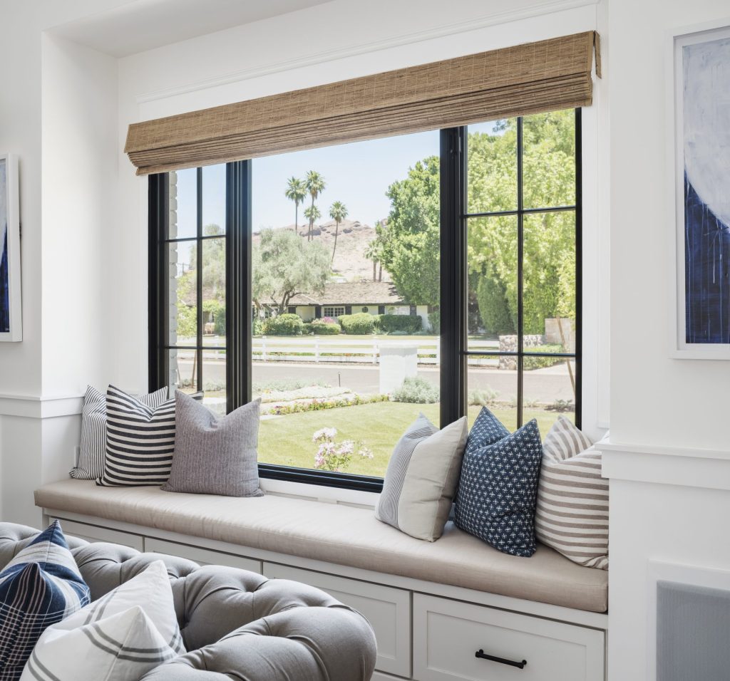 Interior view of bay bow area with aluminum sliding window in a modern home.