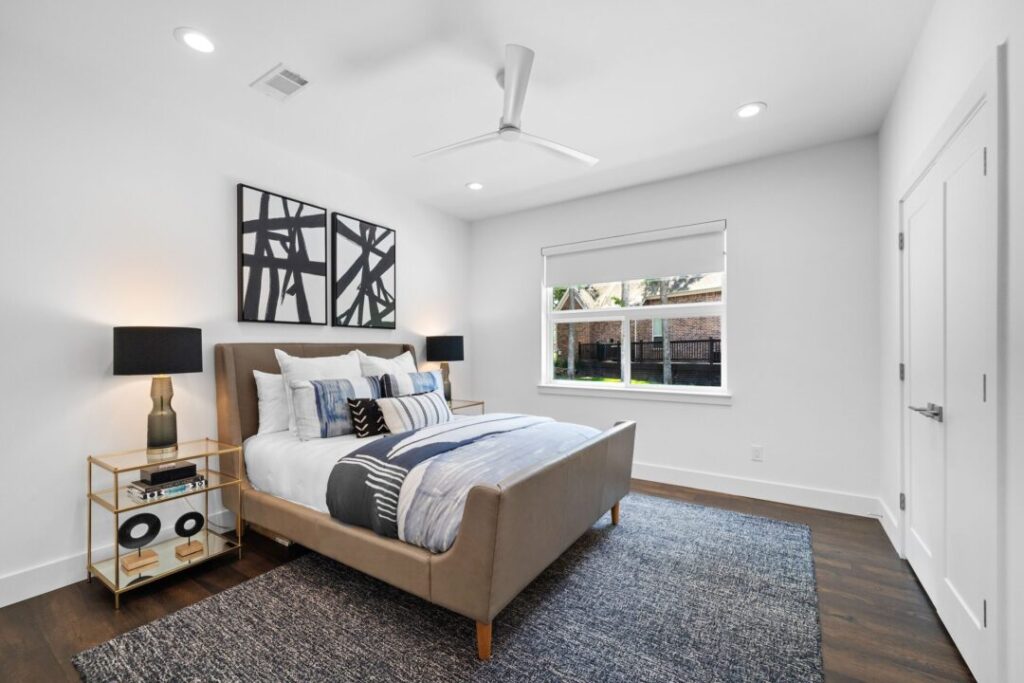 Interior of a modern bedroom with a new double hung window installed.
