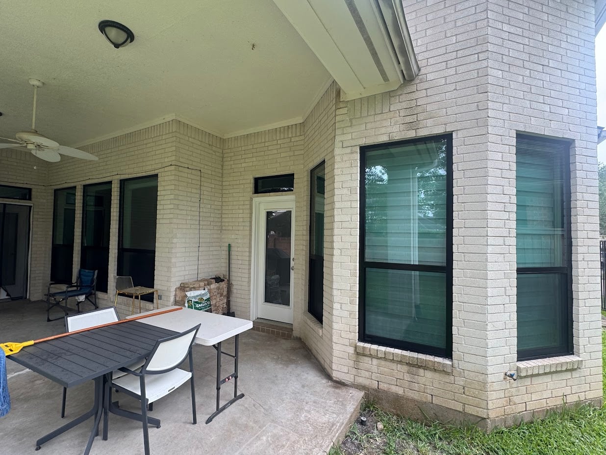 New aluminum replacement windows on a modern home's patio area.